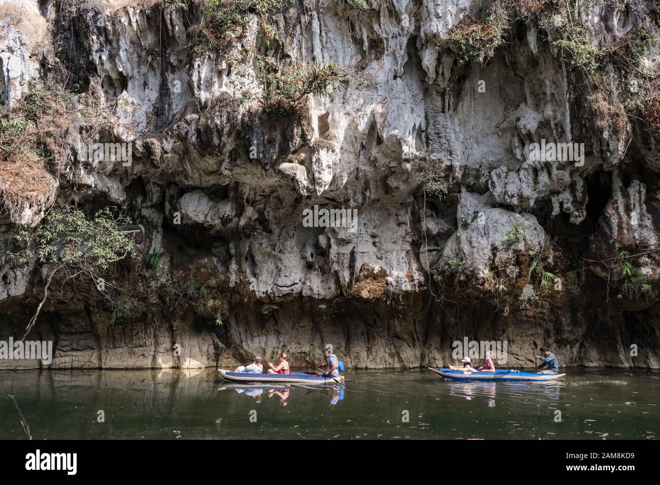 Unidentified tourists are paddling kayak boats in Khao Sok National Park, Thailand Stock Photo