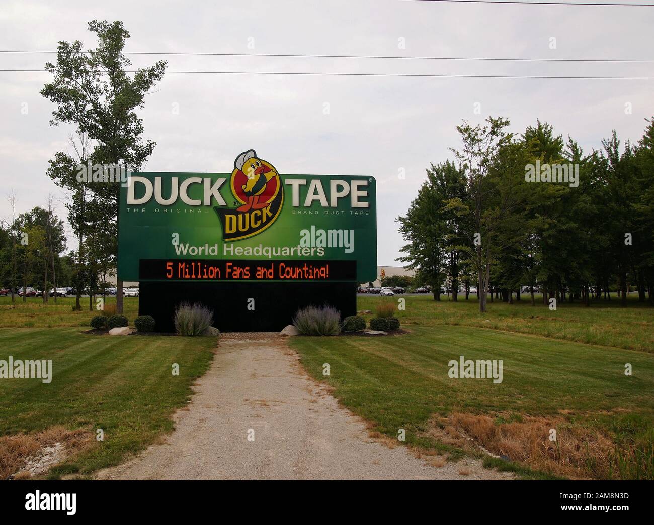 AVON, OHIO - JULY 30, 2018: A giant sign for the Duck Tape World Headquarters featuring the iconic duck logo greets visitors as they enter the parking Stock Photo