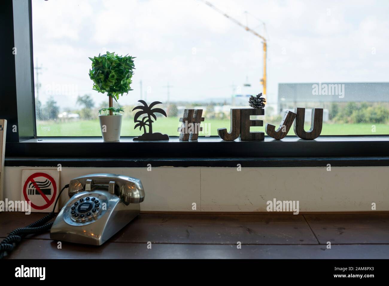 The JEJU letterings made by wood, are lying on the table. Stock Photo