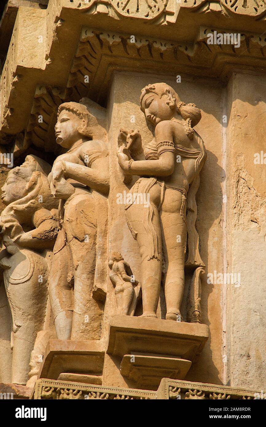 Stone sculpture of beautiful ladies in various poses at Lakshman Temple under Western Temples in Khajuraho, Madhya Pradesh, India, Asia Stock Photo
