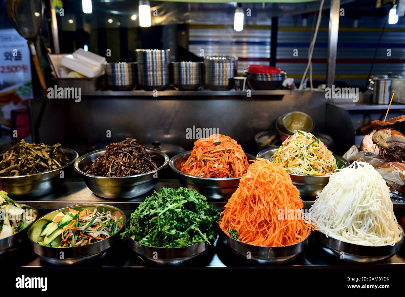 Containers of traditional Korean cooking vegetables and ingredients in