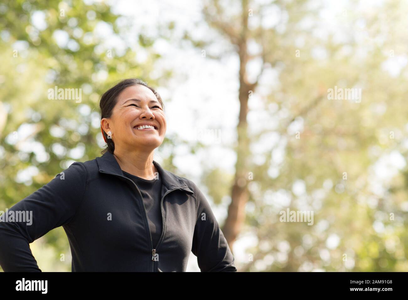 Portrait of a fit Asian woman exercising. Stock Photo