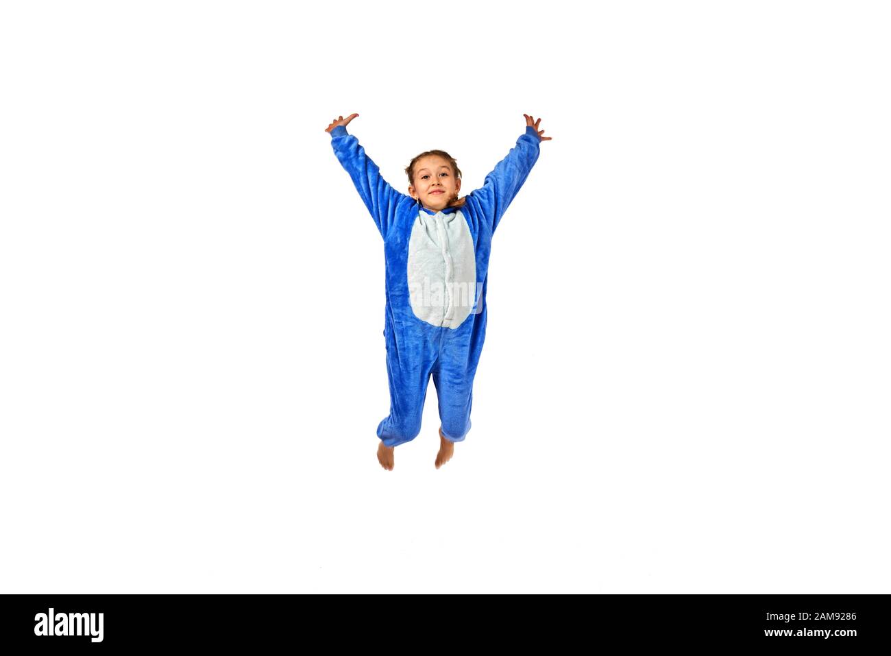 cheerful little girl in pajamas on a white background Stock Photo - Alamy