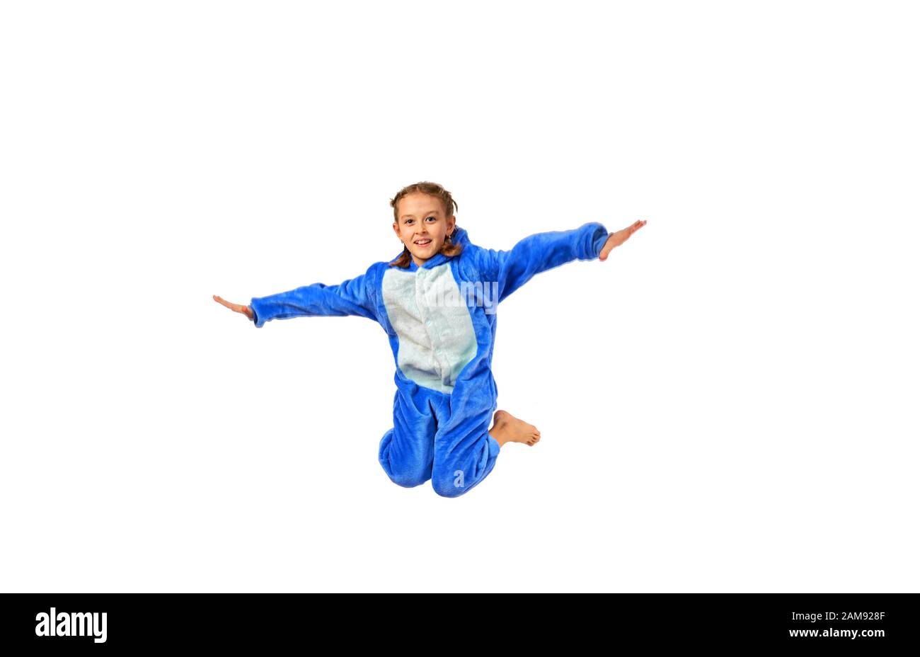 cheerful little girl in pajamas on a white background Stock Photo - Alamy