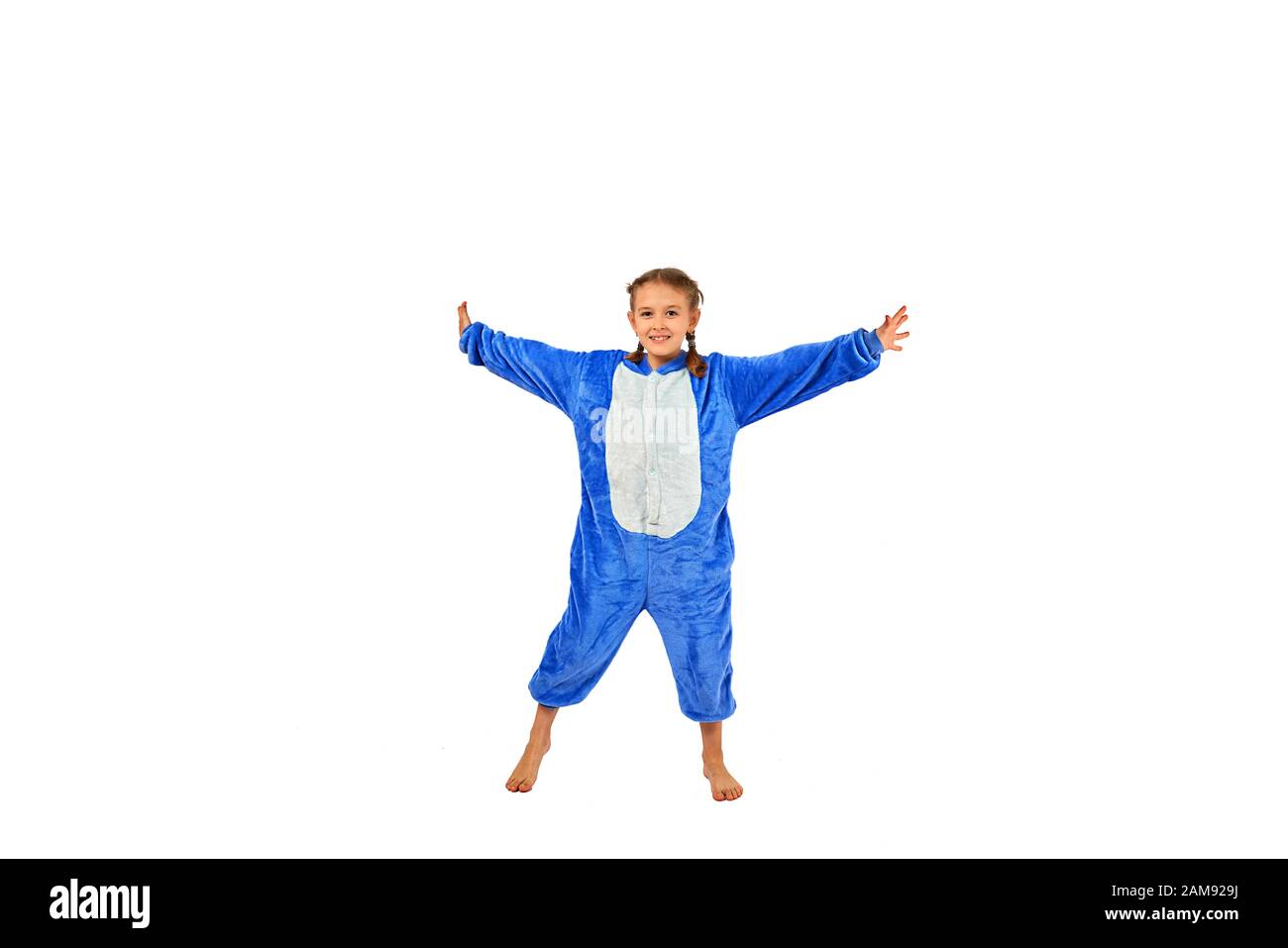 cheerful little girl in pajamas on a white background Stock Photo - Alamy