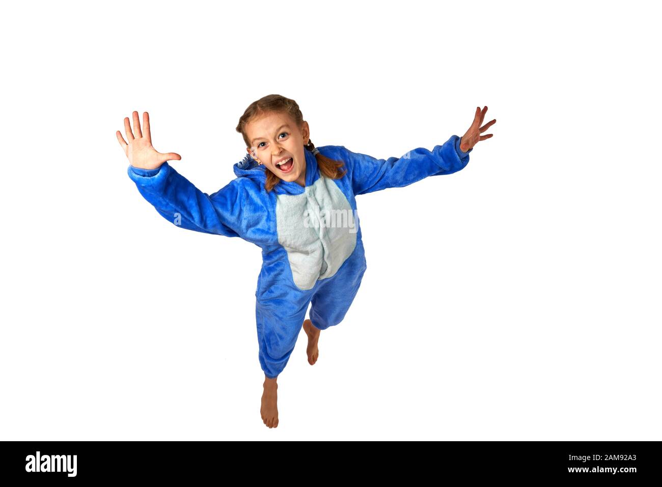 cheerful little girl in pajamas on a white background Stock Photo - Alamy