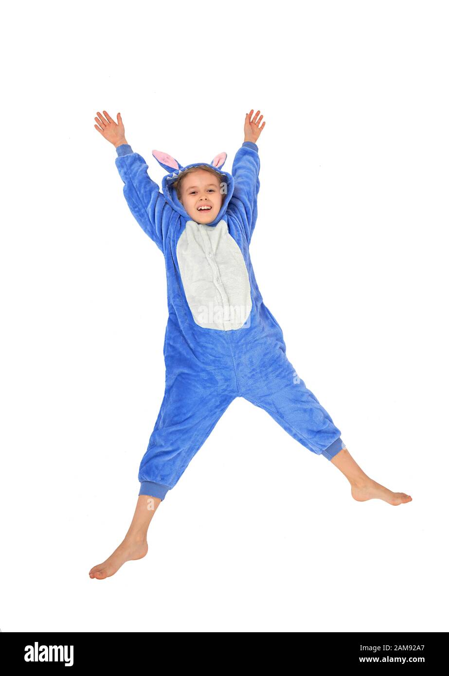 cheerful little girl in pajamas on a white background Stock Photo - Alamy