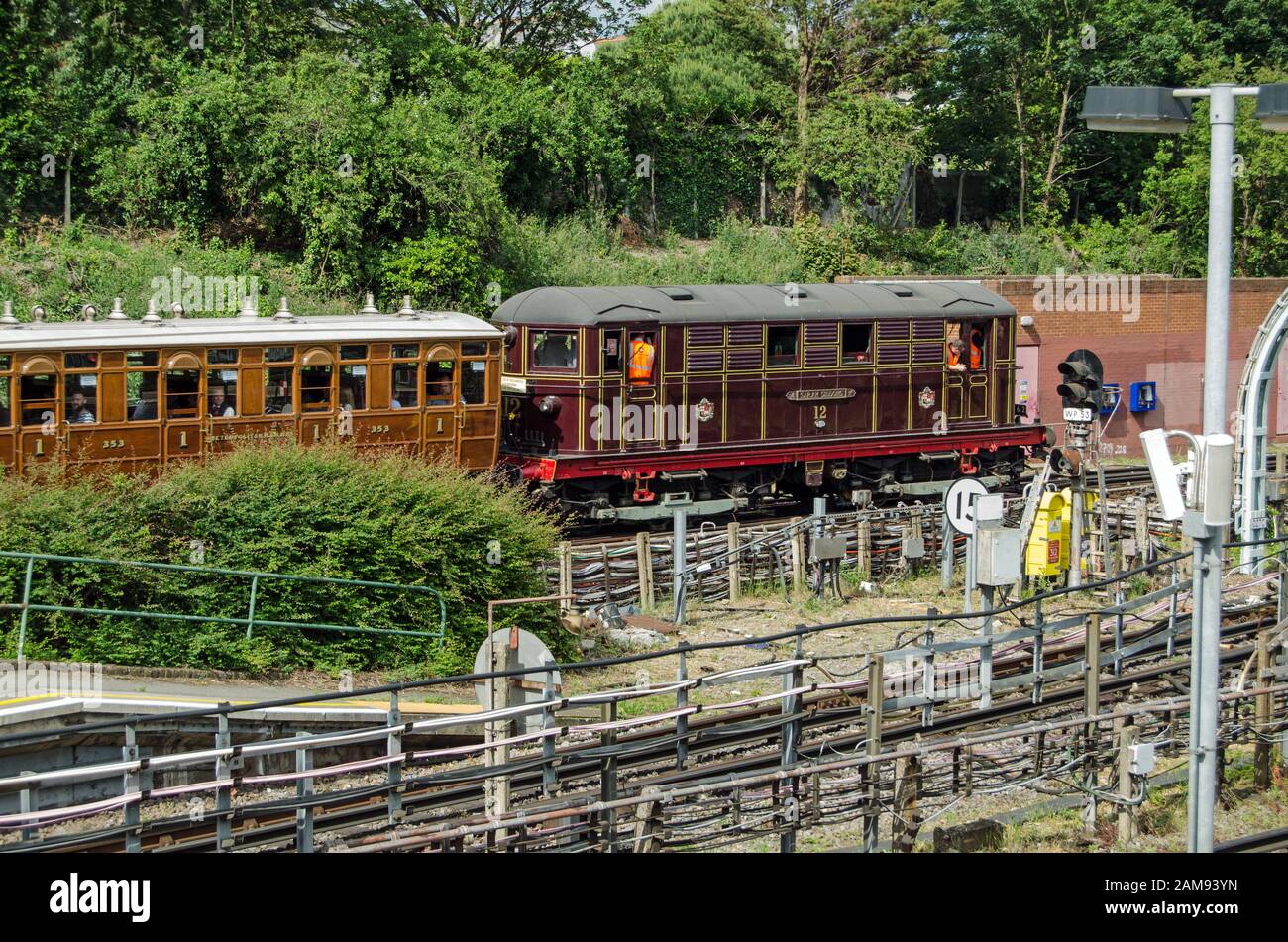 London, UK - June 22, 2019:  Historic Sarah Siddons train engine pulling a series of heritage carriages to mark the 150th anniversary of the District Stock Photo
