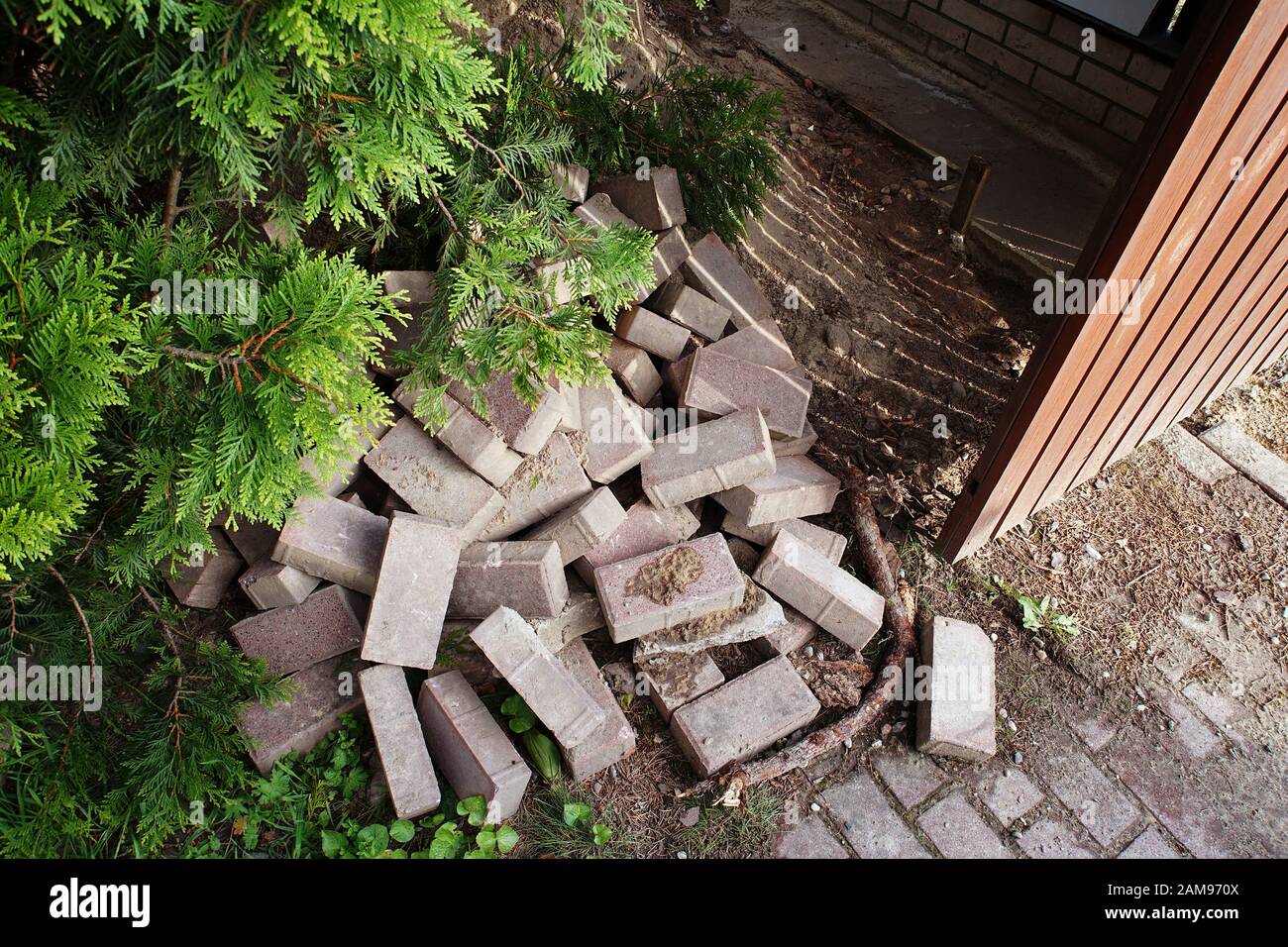 pile of bricks in the garden - demolition before renovation Stock Photo