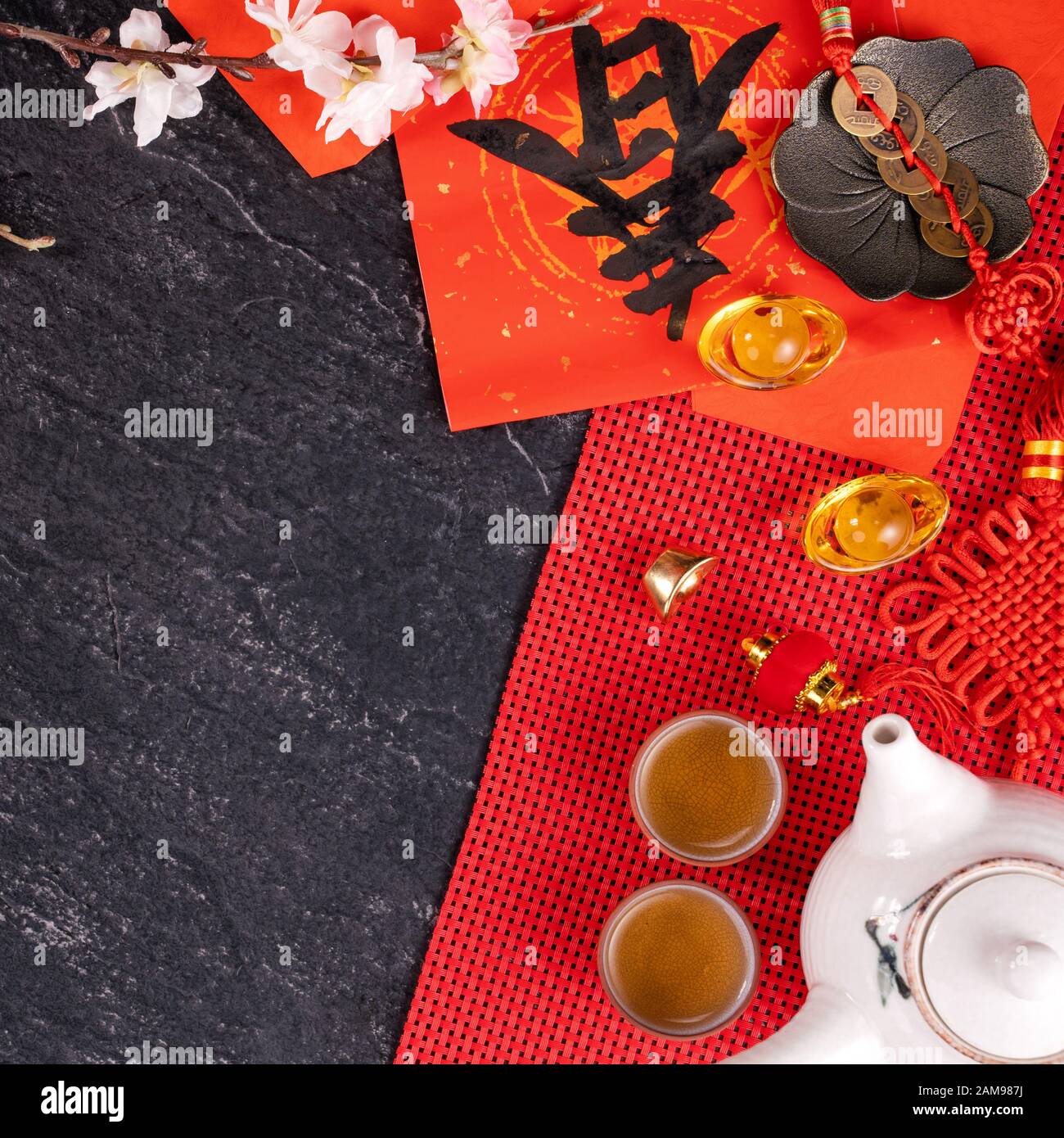 Design concept of Chinese lunar January new year - Festive accessories, red envelopes (ang pow, hong bao), top view, flat lay, overhead above. The wor Stock Photo