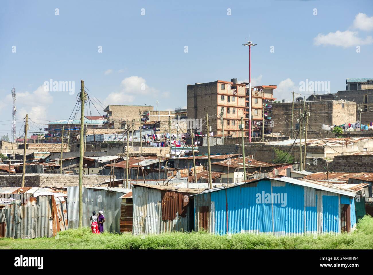 View of Korogocho slum shacks and other buildings, Nairobi, Kenya Stock Photo
