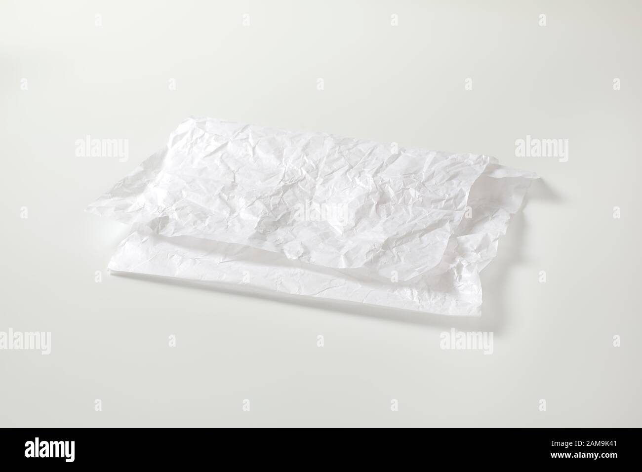 https://c8.alamy.com/comp/2AM9K41/creased-sheet-of-white-wax-coated-butcher-paper-2AM9K41.jpg