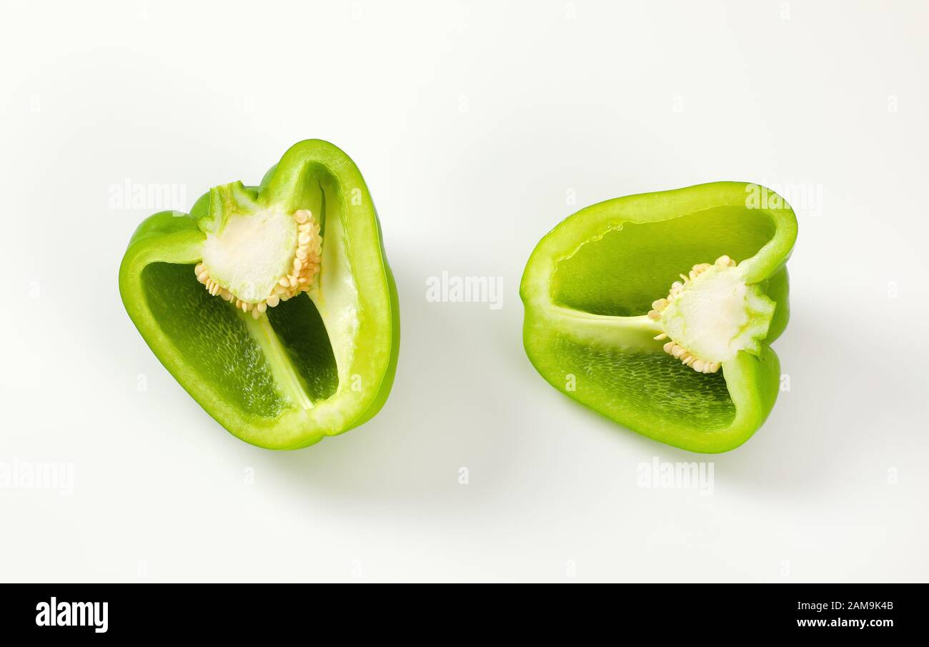 Halved raw green bell pepper Stock Photo Alamy