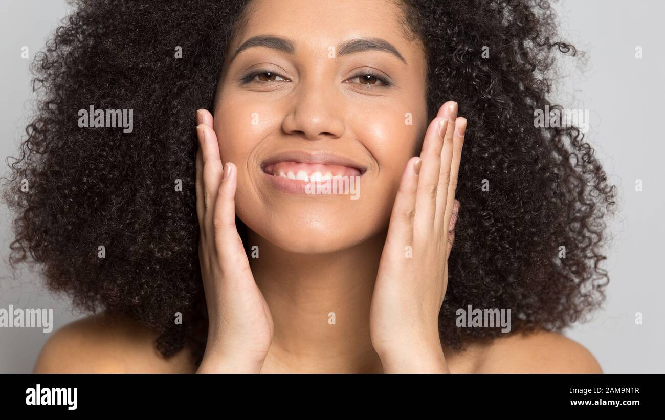 Close up smiling african american woman with perfect skin. Stock Photo