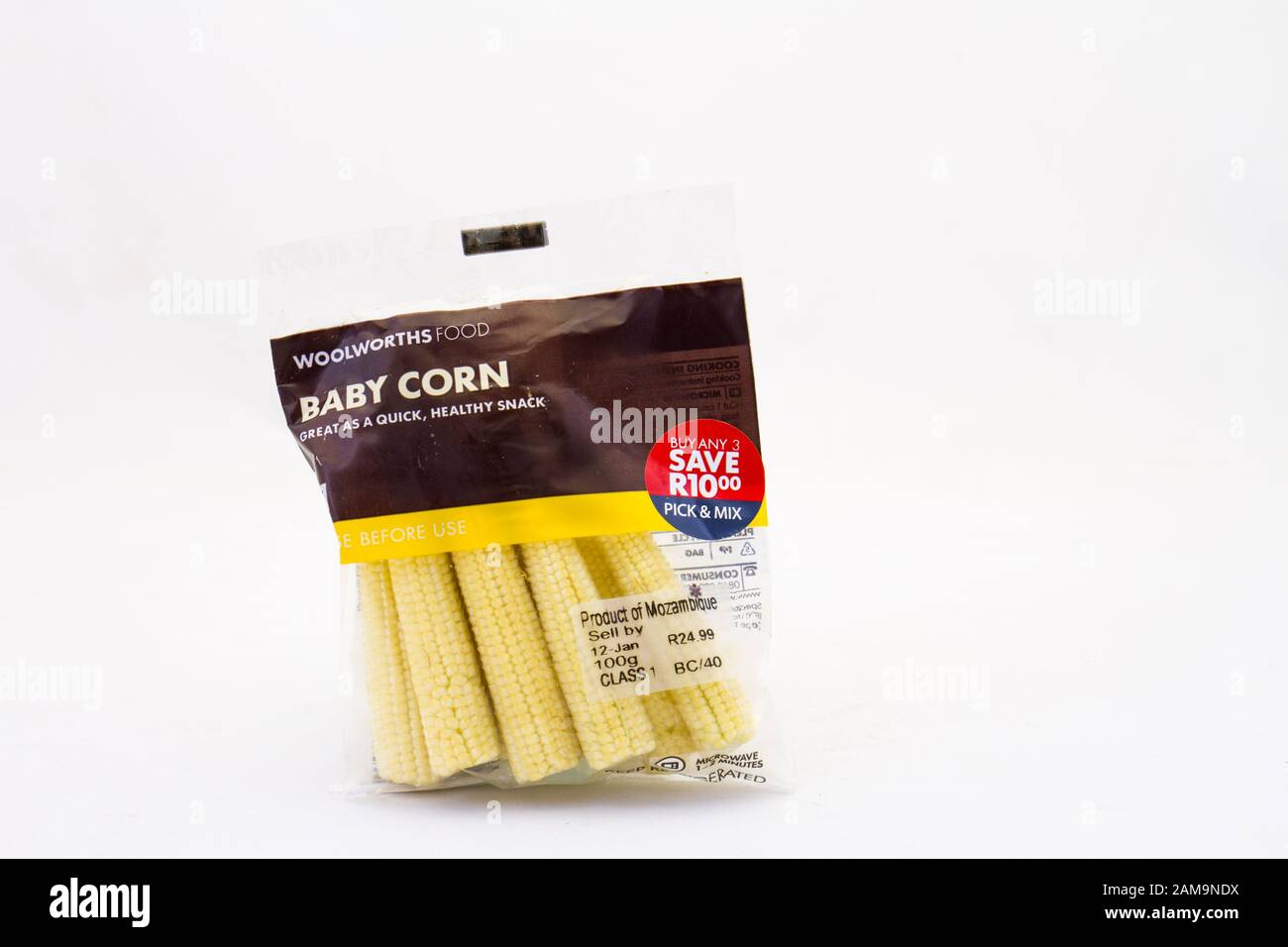 Alberton, South Africa - a packet of Woolworths Food baby corn imported from Mozambique isolated on a white background image in horizontal format Stock Photo