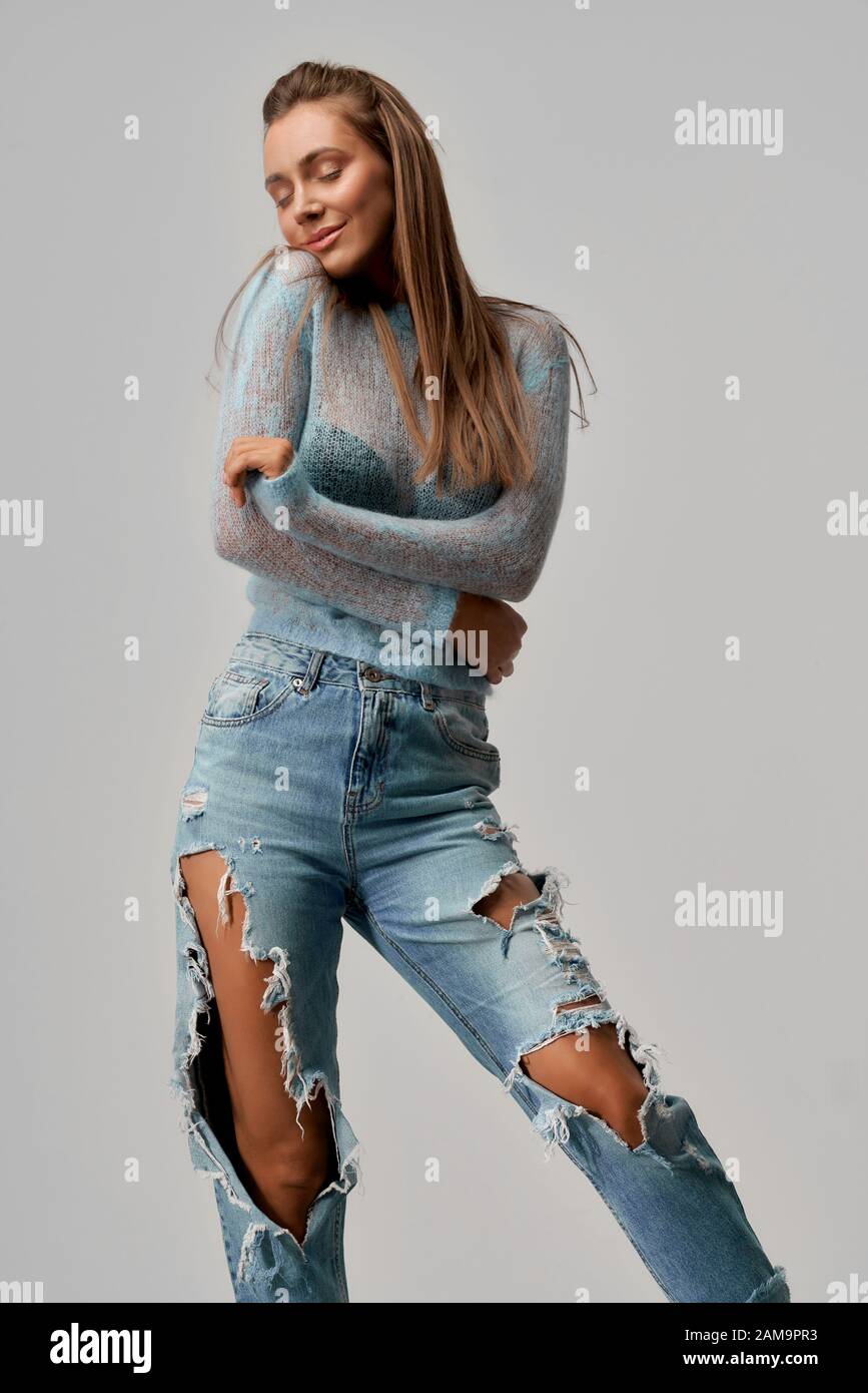 girl wearing ripped jeans