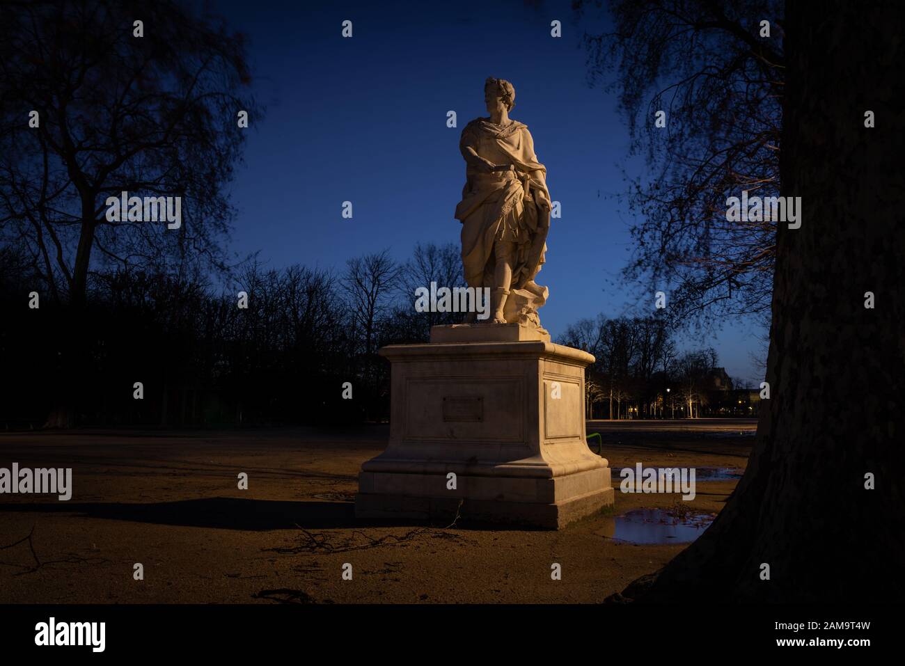 Early morning winter shot of a classical statue of a woman, Tuileries public garden, taken with long exposure, Paris, France Stock Photo