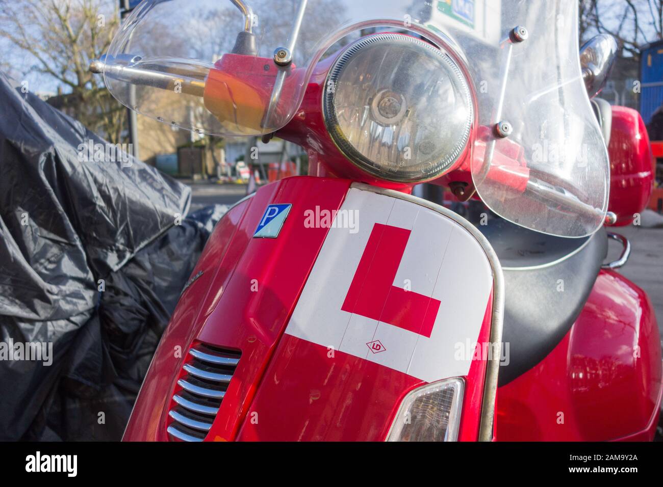 Close-up of a L-plate on a red Vespa Piaggio scooter Stock Photo