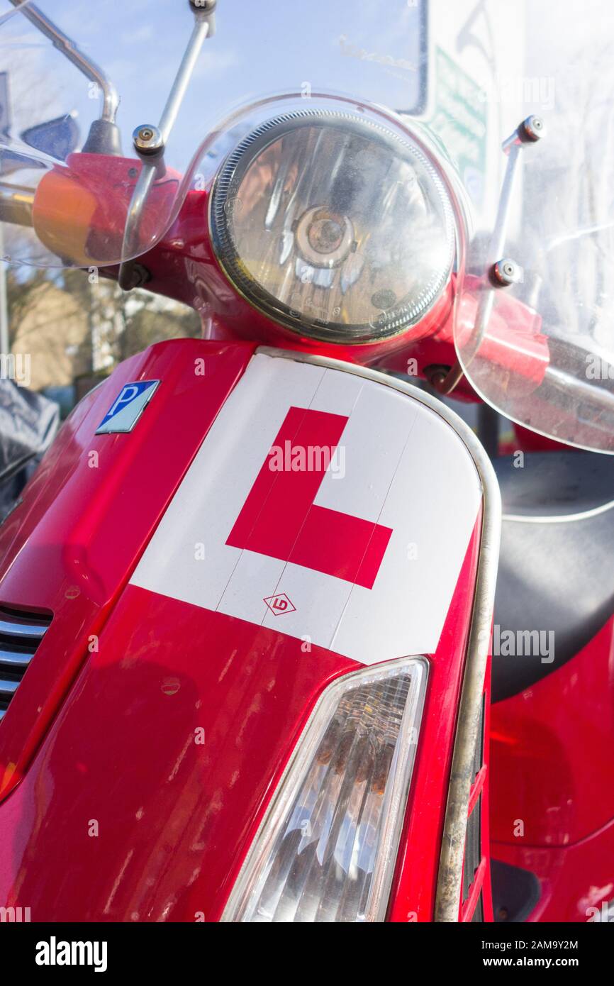 Close-up of an L-plate on a red Vespa Piaggio scooter Stock Photo