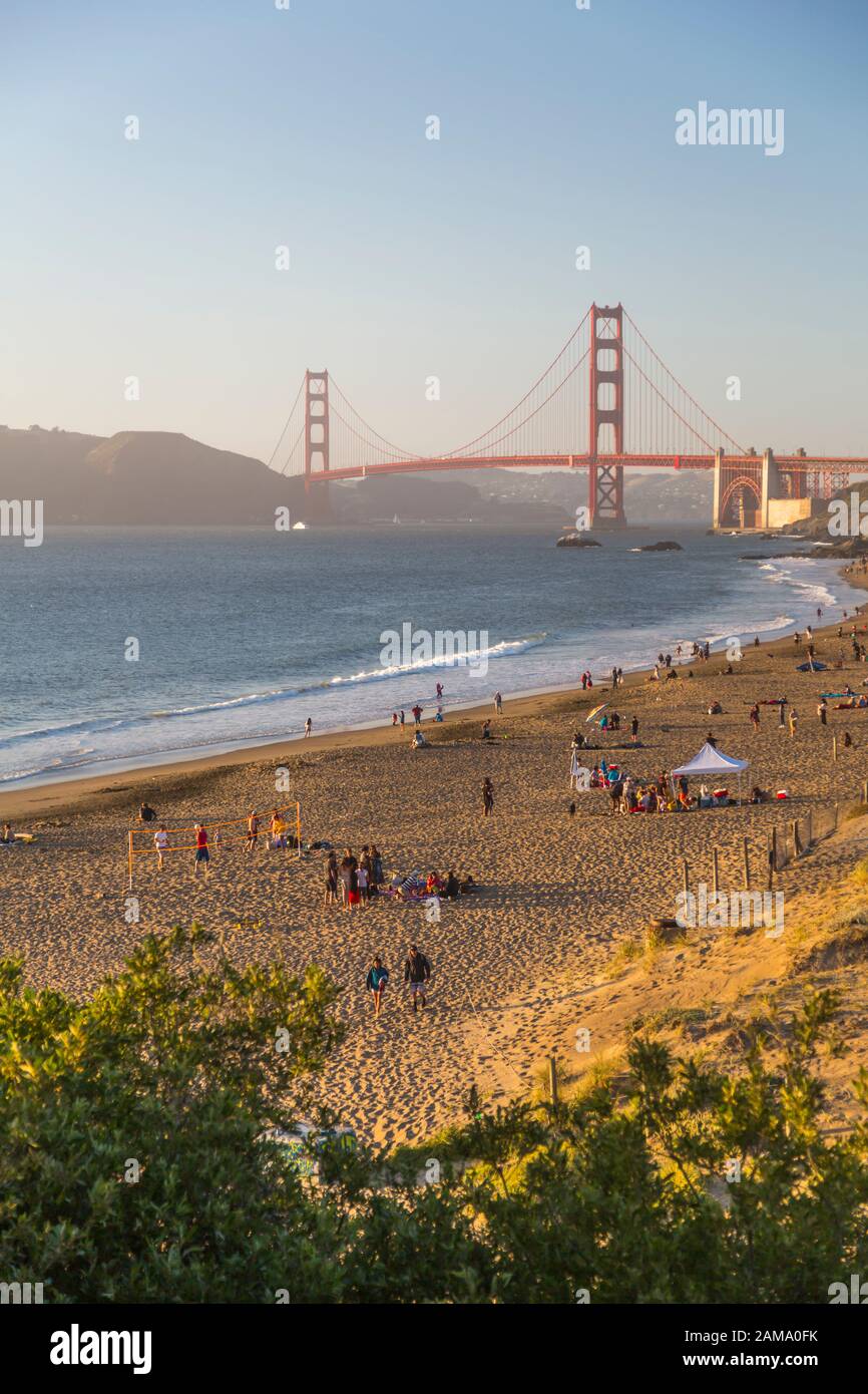 View of Golden Gate Bridge from Baker Beach at dusk, South Bay, San