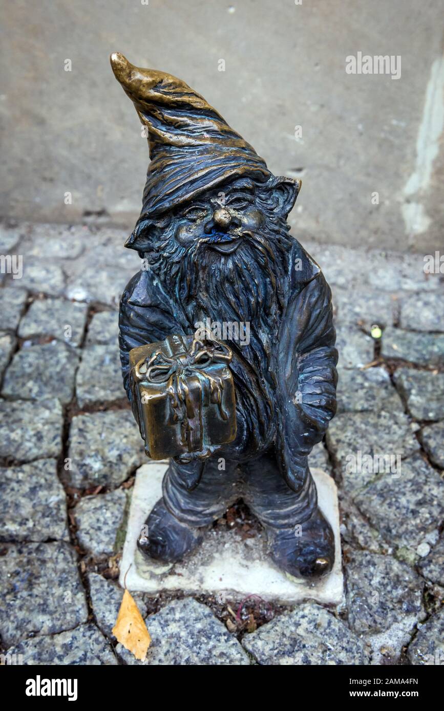Figurine of dwarf called Suvenirek in front of gift shop on the 