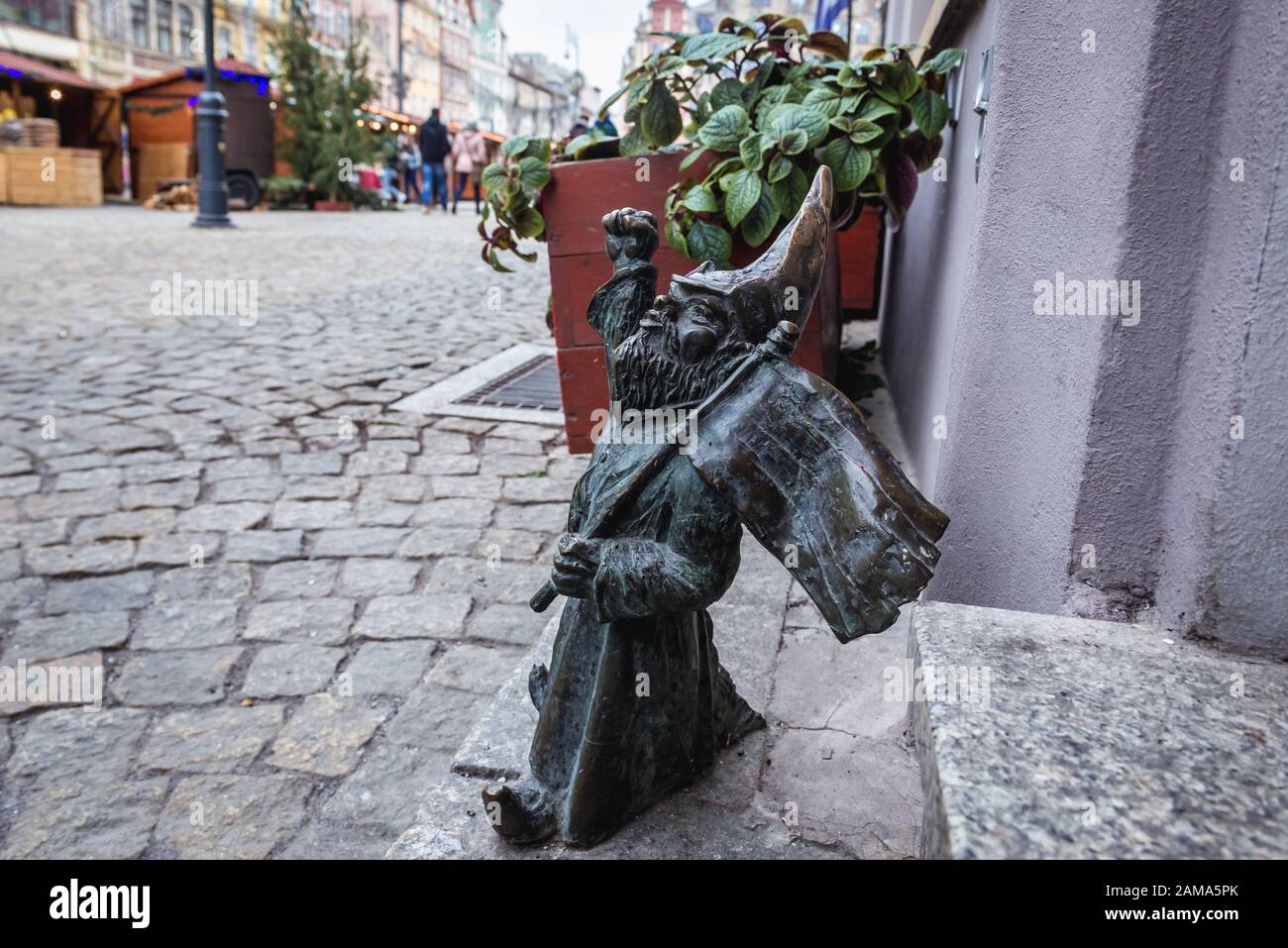 Figurine of dwarf called Przodownik - Foreman in front of PRL bar on the Old Town Market Square of Wroclaw in Silesia region of Poland Stock Photo