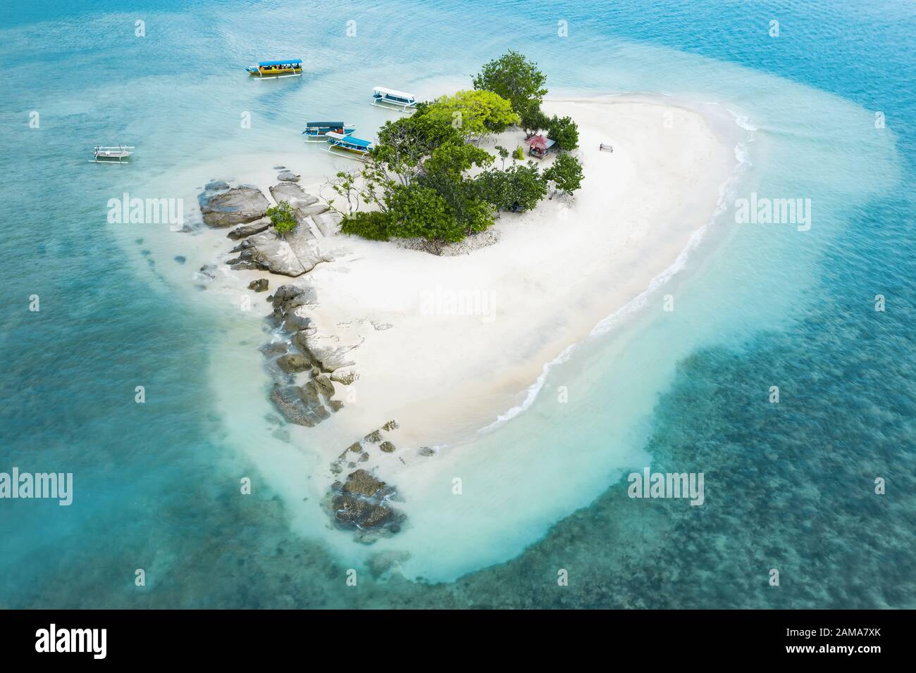 View from above, stunning aerial view of Gili Kedis with a beautiful white sand beach bathed by a turquoise and crystal clear water. Stock Photo