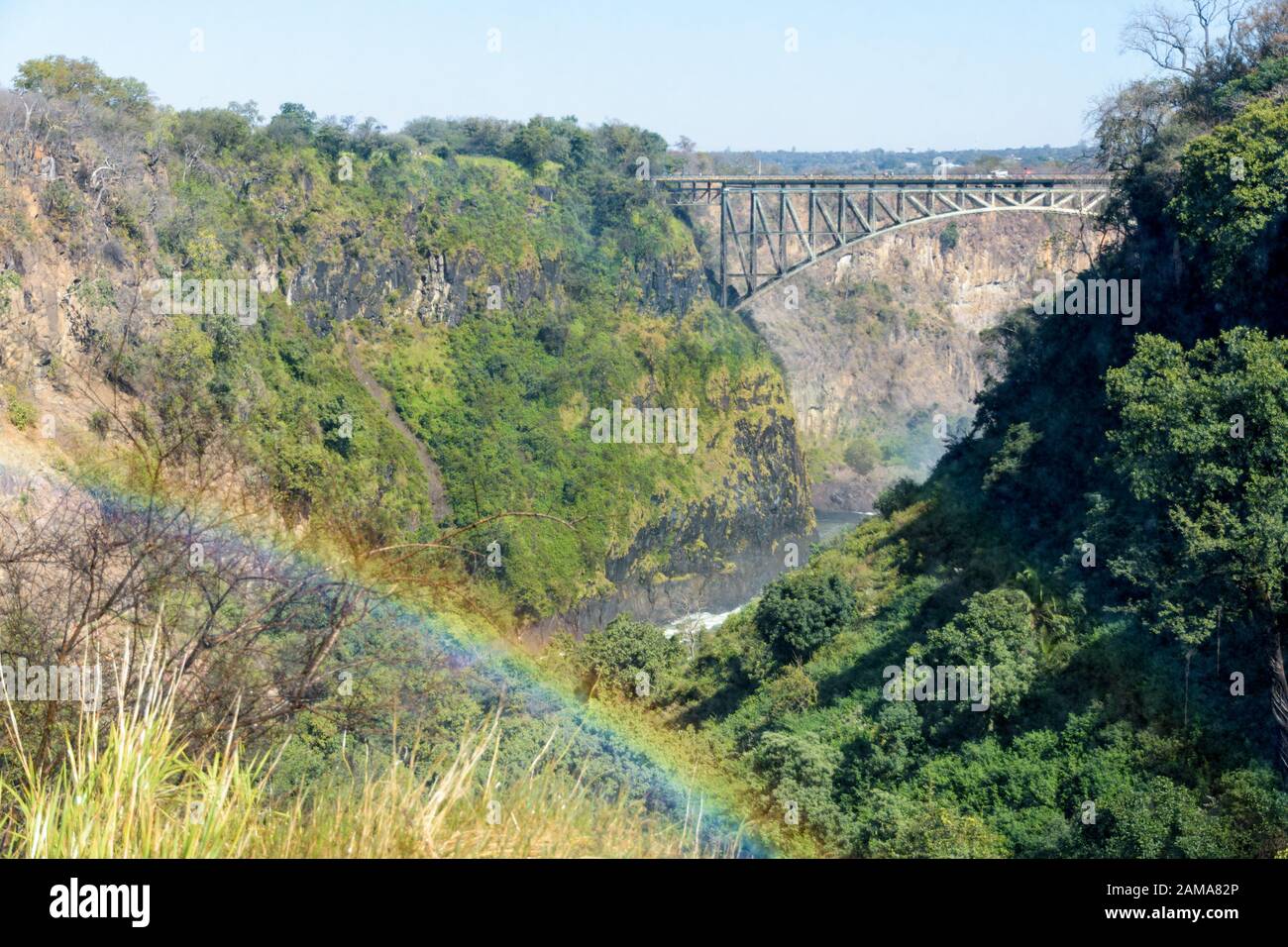 The Victoria Falls bridge over the Zambezi river between Zimbabwe and Zambia, with rainbow Stock Photo