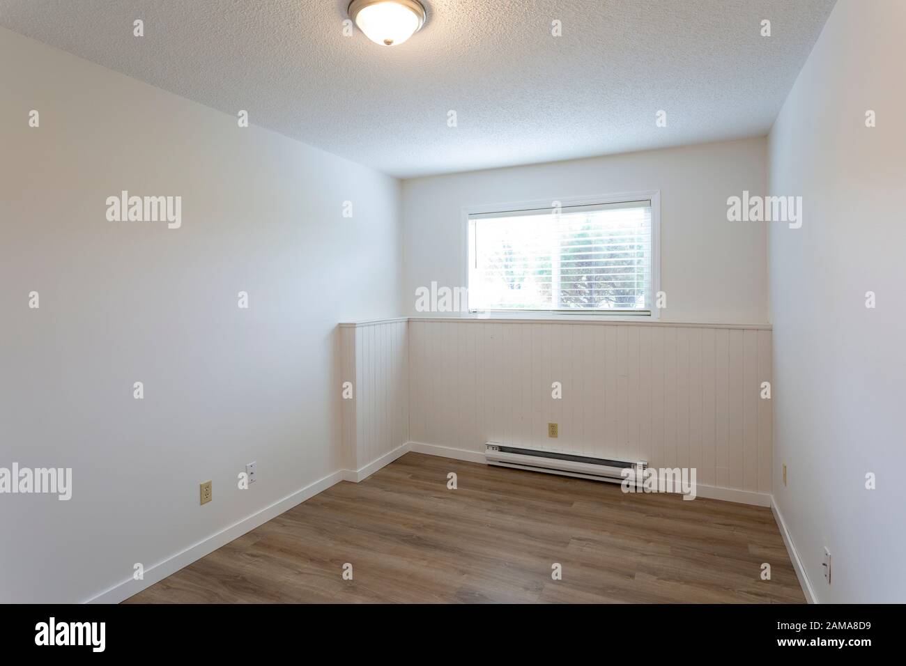 Interior of empty renovated apartment condo rental unit with white