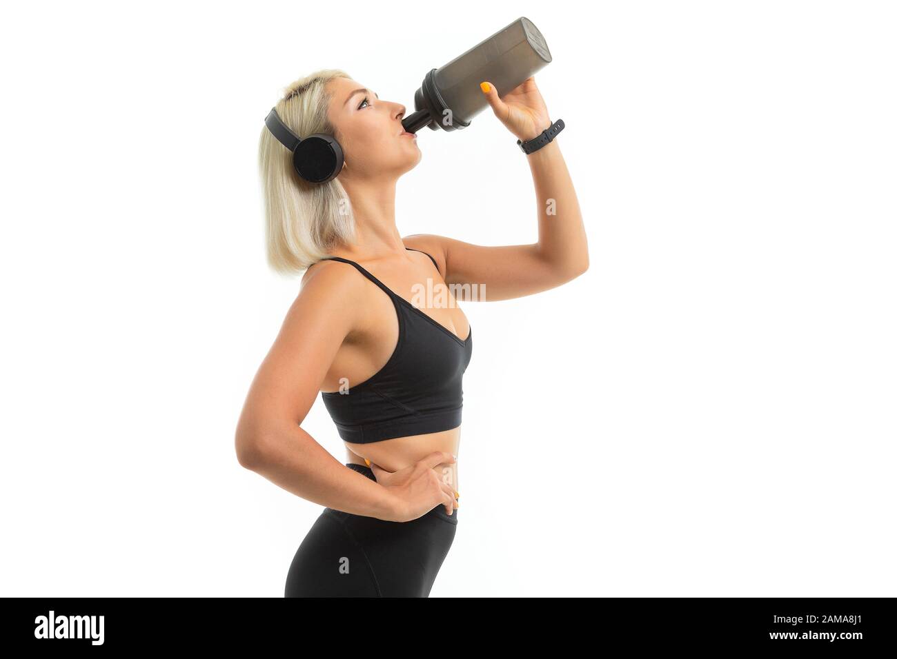Caucasian sport woman with blonde hair listen to music with big ...