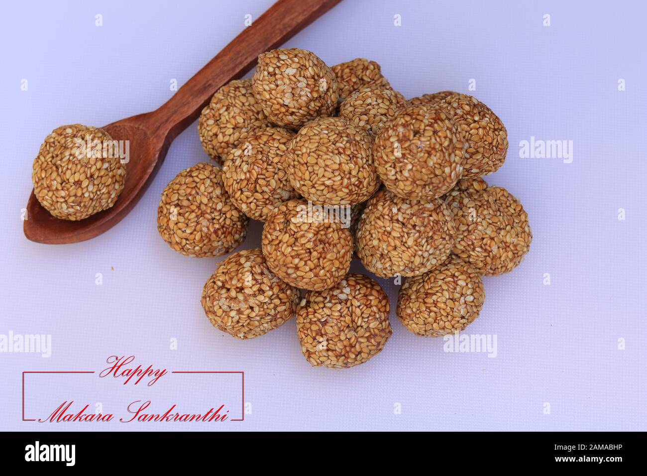 Til Gul OR Sweet Sesame Laddu for Indian festival Makar Sankranti over white background Stock Photo