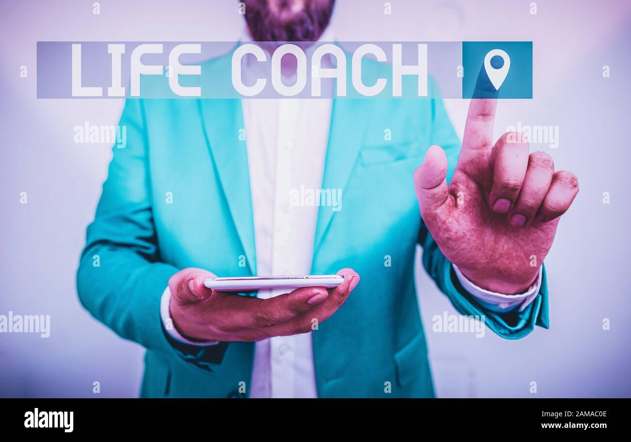 Handwriting text writing Life Coach. Conceptual photo someone who helps identify your goals and plan to achieve them Businessman in the blue suite wit Stock Photo