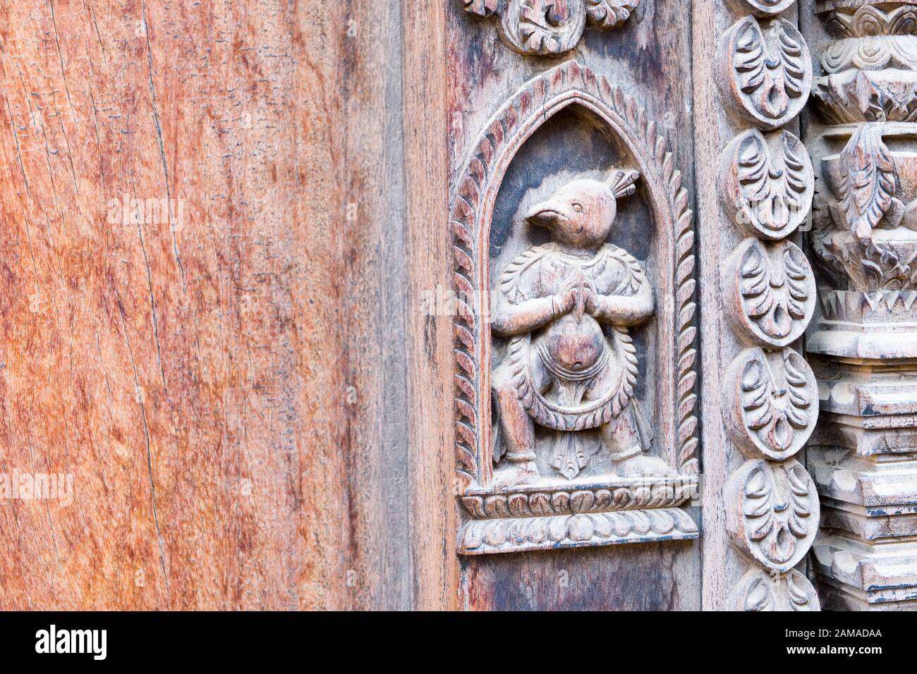Decorative wood carving on temple door in Bhaktapur, Nepal Stock Photo