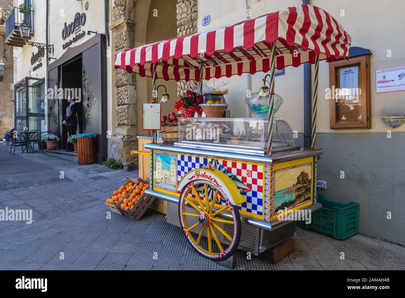 Ice cream and fresh juices cart on Piazza Duomo in Cefalu city located on the Tyrrhenian coast of Sicily, Italy Stock Photo