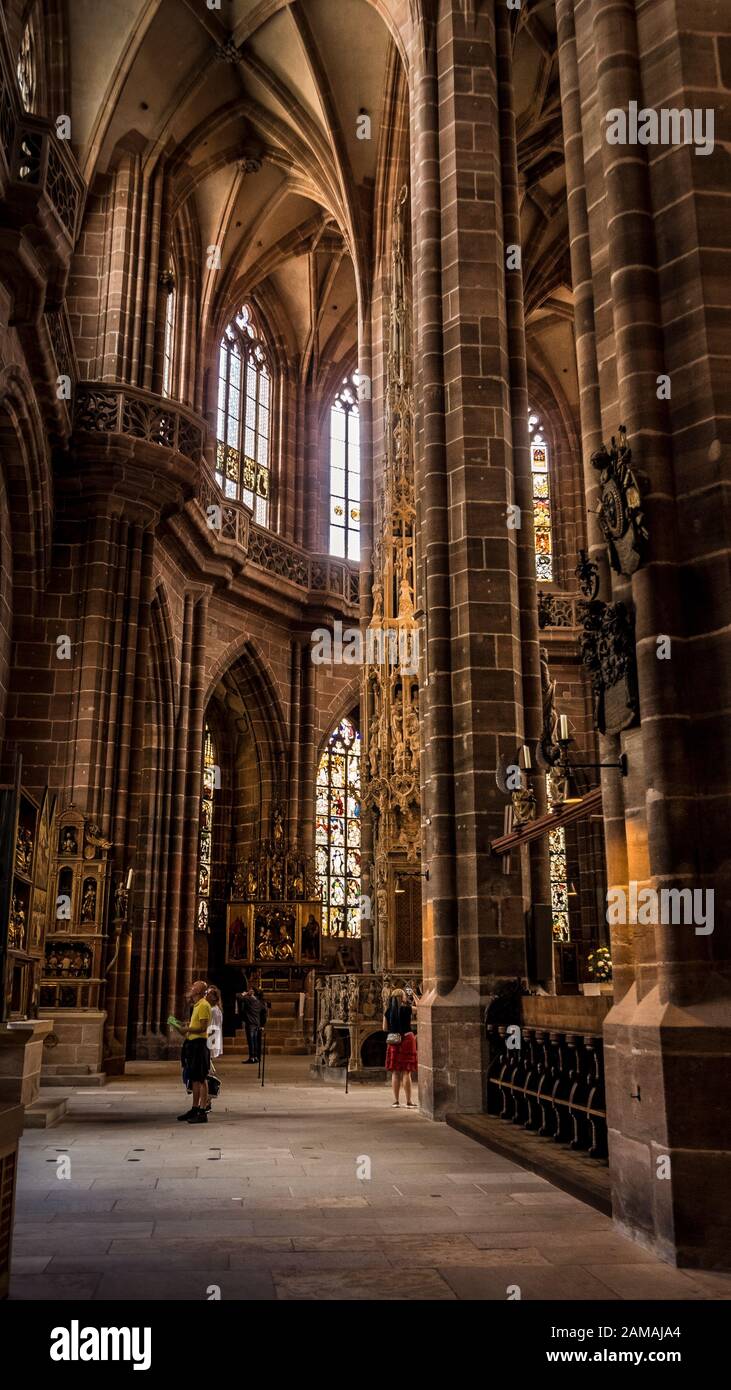 Nuremberg 2019. Interior nave of Cathedral of St. Lorenz, or Lawrence. We are on a Sunday and the faithful give way to visiting tourists. August 2019 Stock Photo