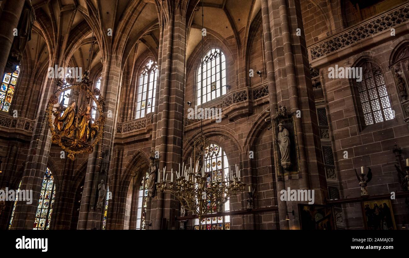 Nuremberg 2019. Interior nave of Cathedral of St. Lorenz, or Lawrence. We are on a Sunday and the faithful give way to visiting tourists. August 2019 Stock Photo