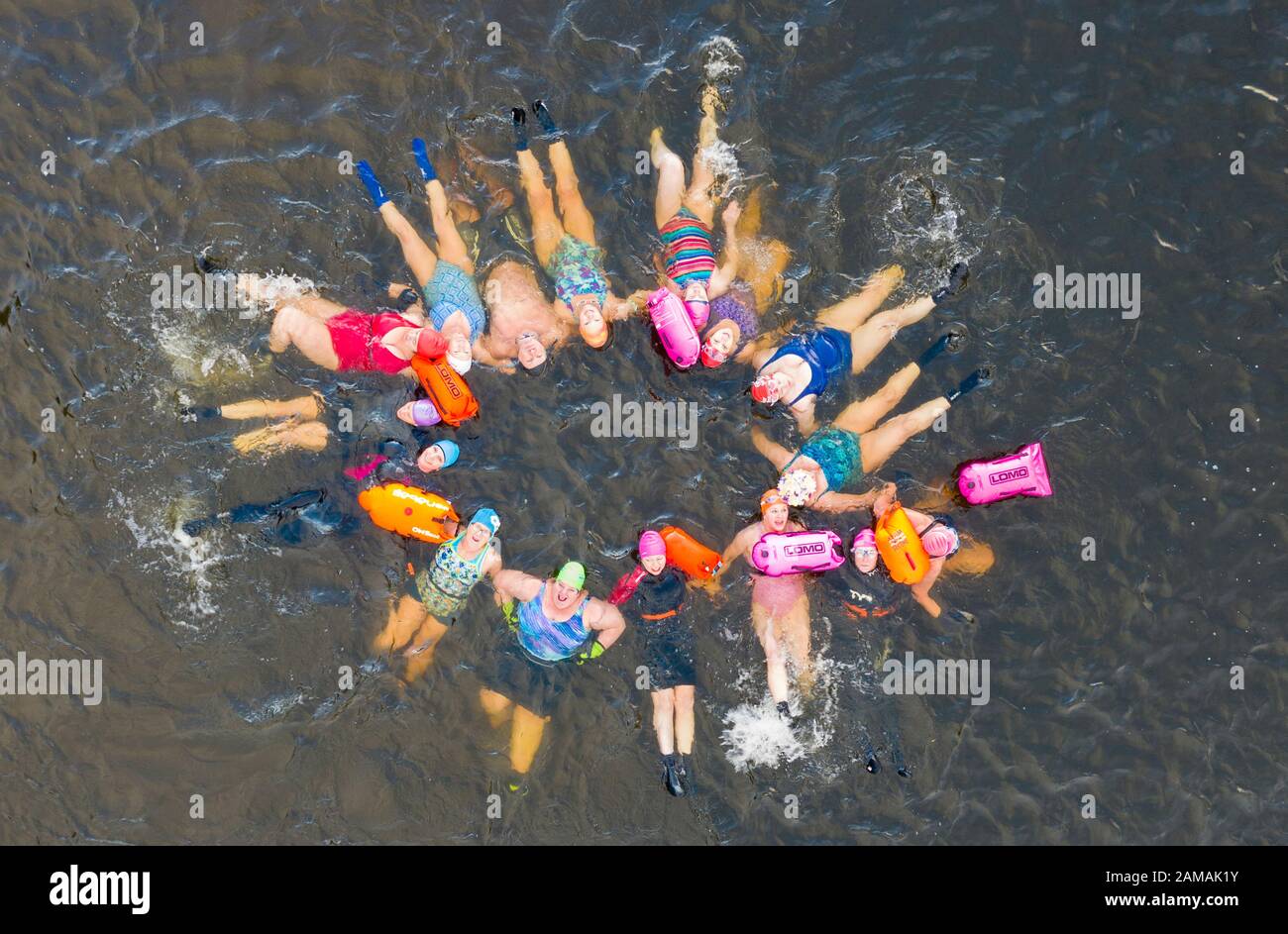 Callander, Scotland, UK. 12th Jan 2020. Drone images of open water swimmers from the Fife Wild Swimmers club take advantage of the cold but sunny weather to go swimming in Loch Lubnaig in The Trossachs, Stirlingshire. Apart from their usual swim they took time to have fun and practice some synchronised swimming moves before the cold forced them from the loch.  Iain Masterton/Alamy Live News Stock Photo