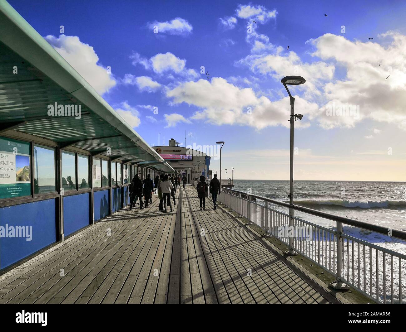 Bournemouth, UK. 12th Jan, 2020. People enjoy the winter sun with a walk on the pier in Bournemouth, Dorset. Uncommonly warm weather in the UK. Credit: Thomas Faull/Alamy Live News Stock Photo