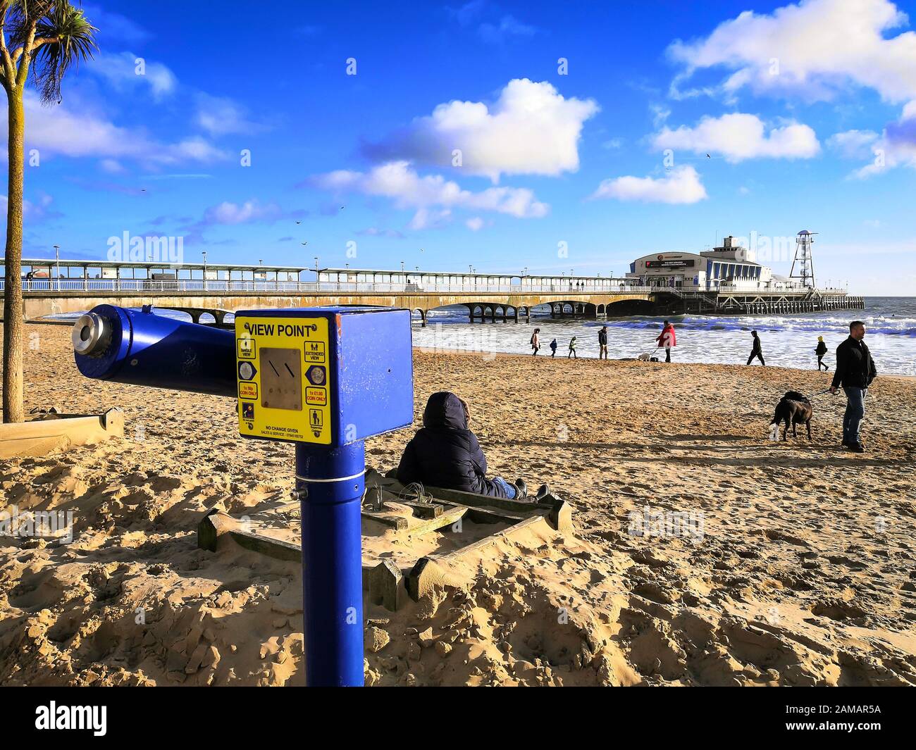 Bournemouth, UK. 12th Jan, 2020. People enjoy the winter sun with a walk on the beach in Bournemouth, Dorset. Uncommonly warm weather in the UK. Credit: Thomas Faull/Alamy Live News Stock Photo