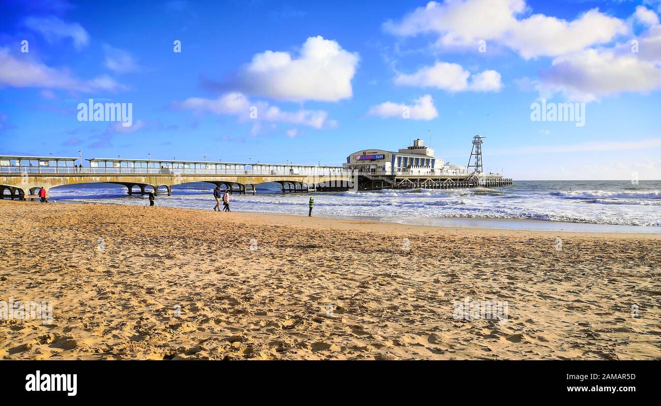 Bournemouth, UK. 12th Jan, 2020. People enjoy the winter sun with a walk on the beach in Bournemouth, Dorset. Uncommonly warm weather in the UK. Credit: Thomas Faull/Alamy Live News Stock Photo