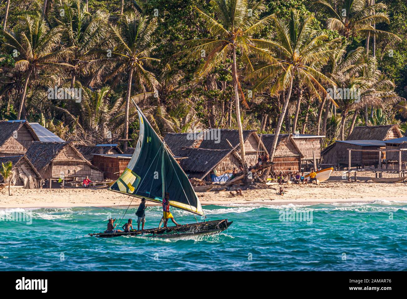 Polynesian style sailing on a Proa (multihull outrigger sailboat) in Papua New Guinea Stock Photo