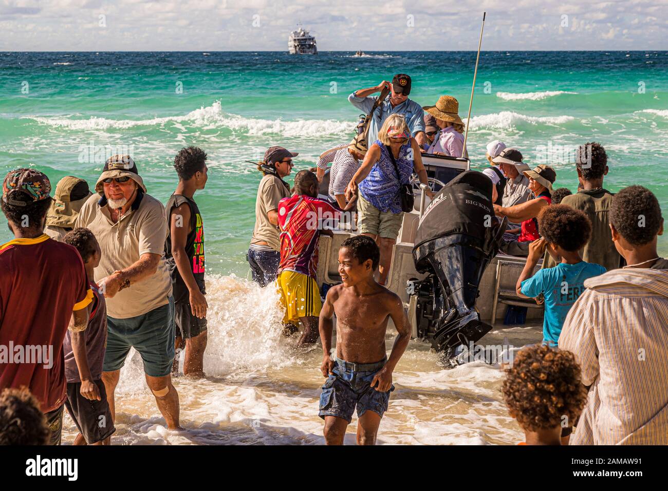 Local people and tourists are meeting on a beach in Papua New Guinea Stock Photo