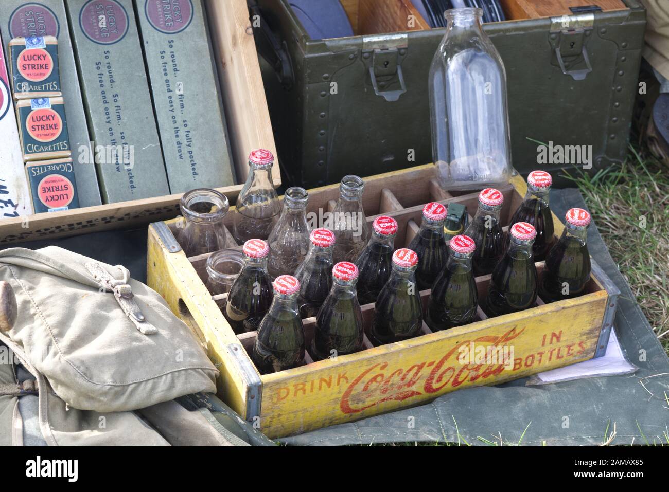 Lucky strike cigarettes and coca cola bottles  in an American encampment of the reenactment of world war 11 Stock Photo