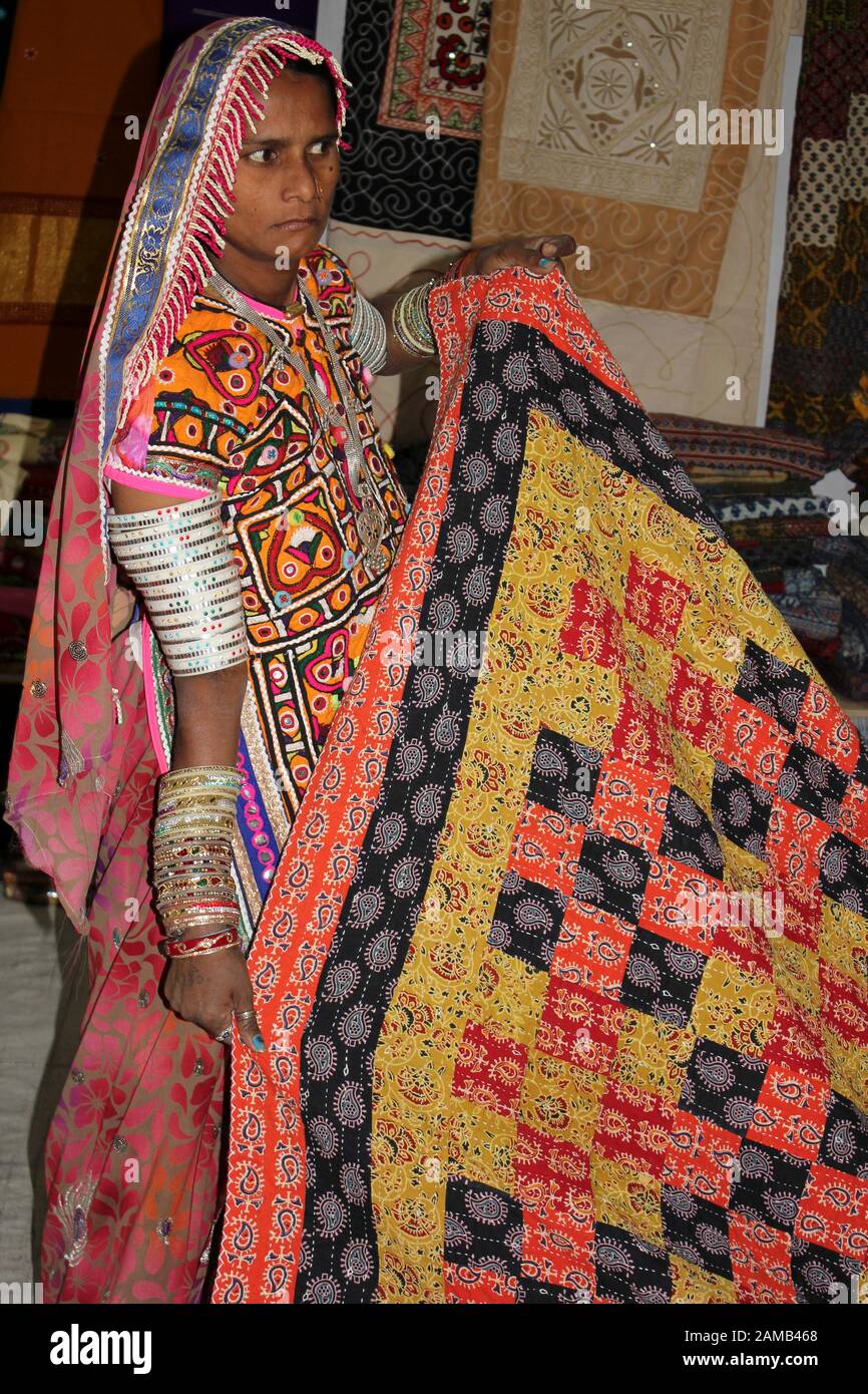 Meghwal Woman of Bhirandiyara village, Great Rann Of Kutch displaying a traditional quilt Stock Photo
