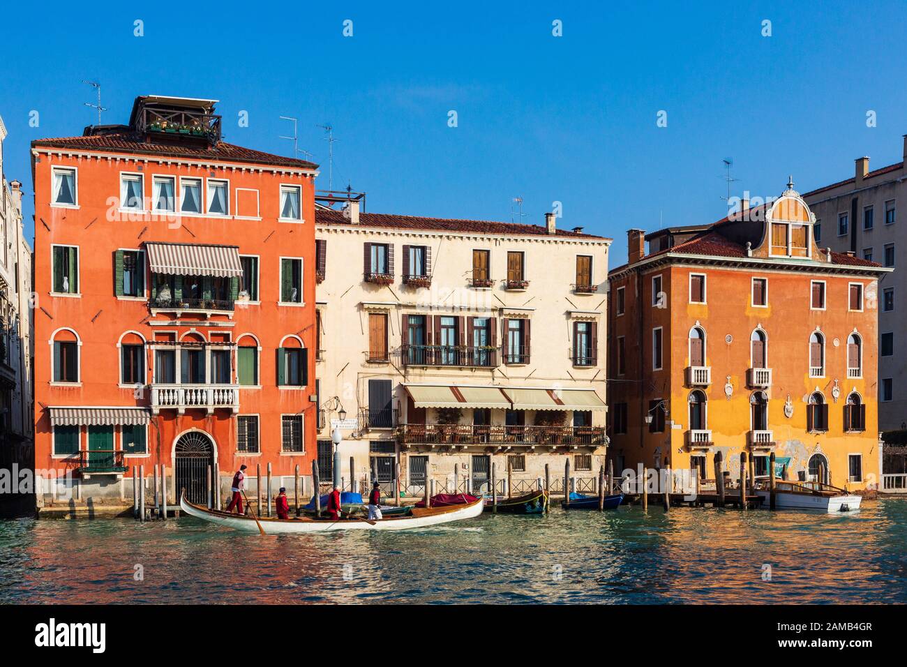 Boat in front of palaces on the Grand Canal, Venice, Veneto, Italy, Europe Stock Photo