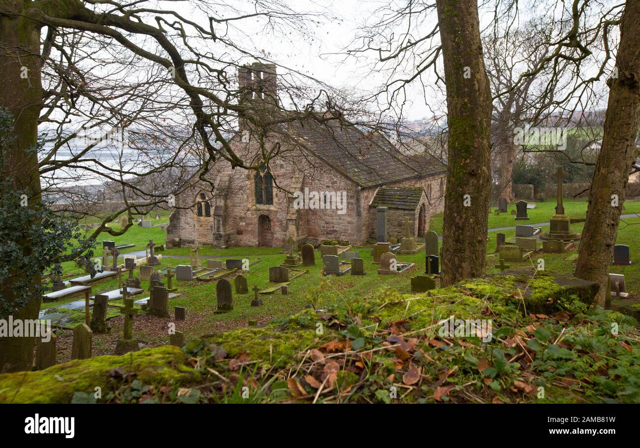 St Peter’s Church near the village of Heysham and Throbshaw, or Throbshire, Point on the edge of Morecmbe Bay. It is believed there has been a church Stock Photo