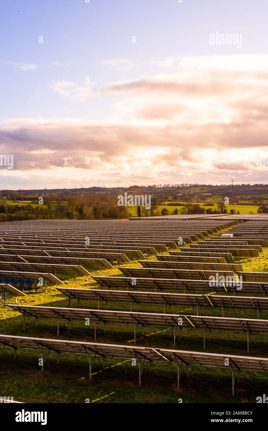 Aerial view of a solar farm in Staffordshire, renewable, sustainable energy due to climate change, natural energy Solar panels in the countryside Stock Photo