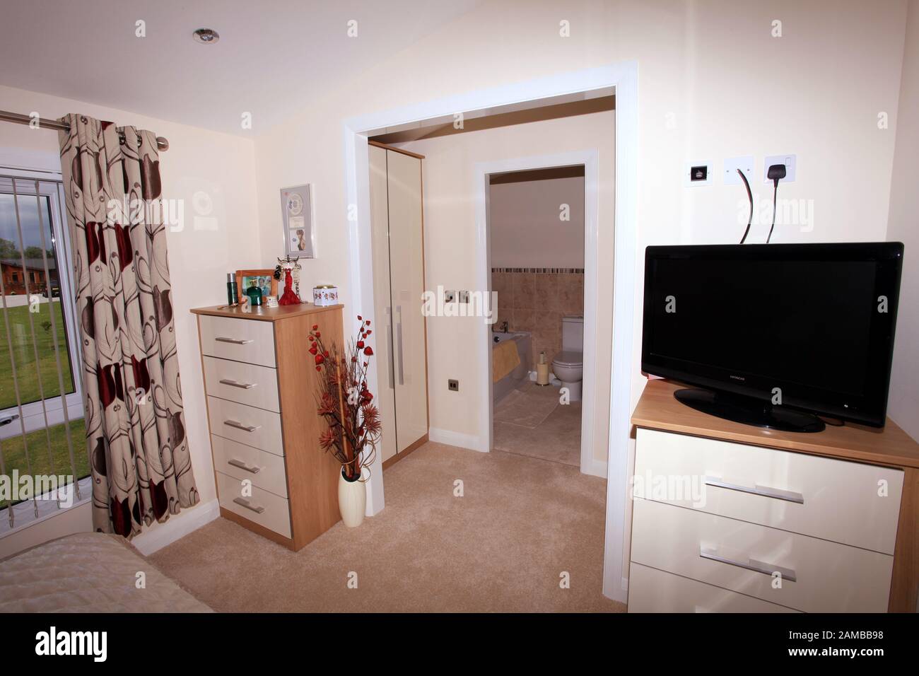 Luxury Interior Bedroom Of A Log Cabin Style Static Caravan Stock