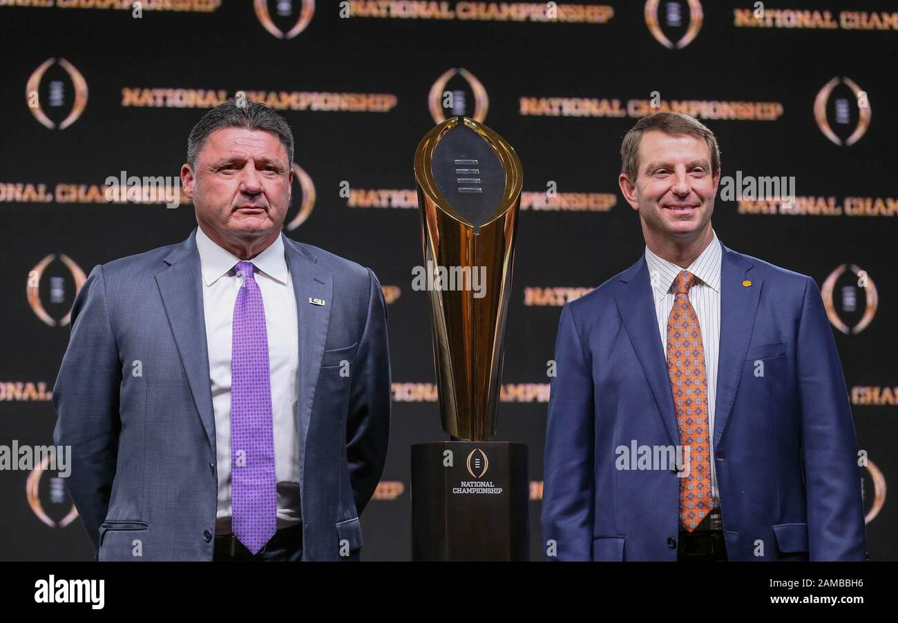 New Orleans, LA, USA. 12th Jan, 2020. LSU Head Coach Ed Orgeron and Clemson Head Coach Dabo Swinney pose with the Championship Trophy after the Head Coaches Press Conference before the College Football National Championship between the Clemson Tigers and the LSU Tigers at the Sheraton Hotel in New Orleans, LA. Jonathan Mailhes/CSM/Alamy Live News Stock Photo
