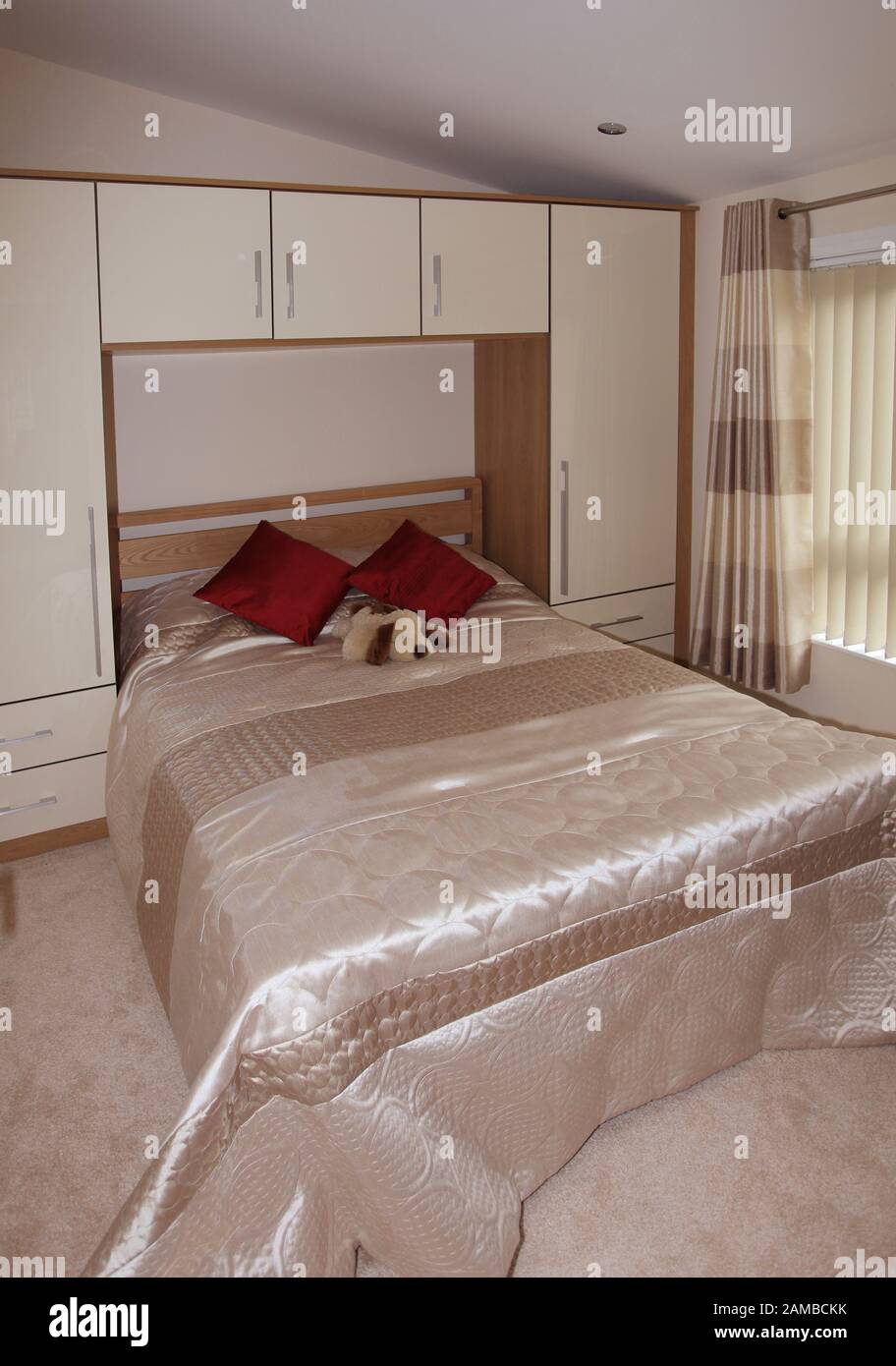 Luxury Interior Bedroom Of A Log Cabin Style Static Caravan Stock